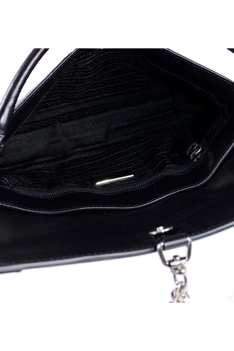RESERVED // 1990s Prada Black & White Perforated Leather Top Handle Handbag