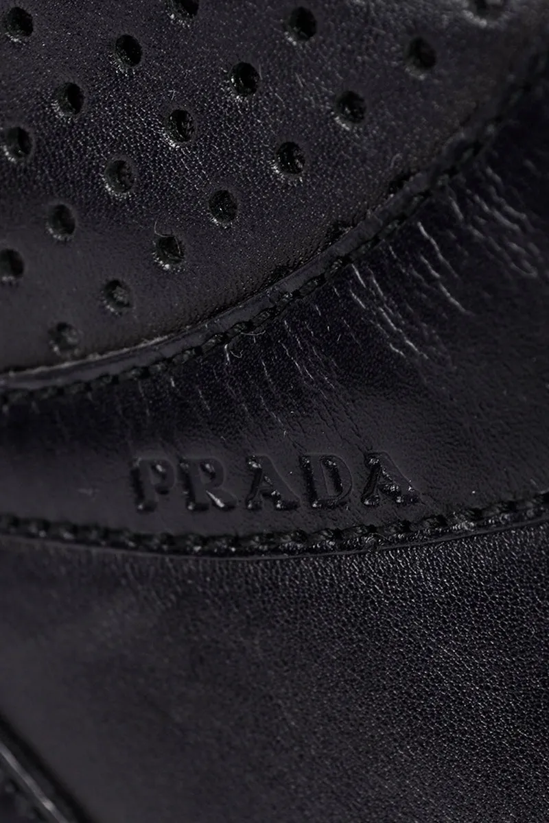 RESERVED // 1990s Prada Black & White Perforated Leather Top Handle Handbag
